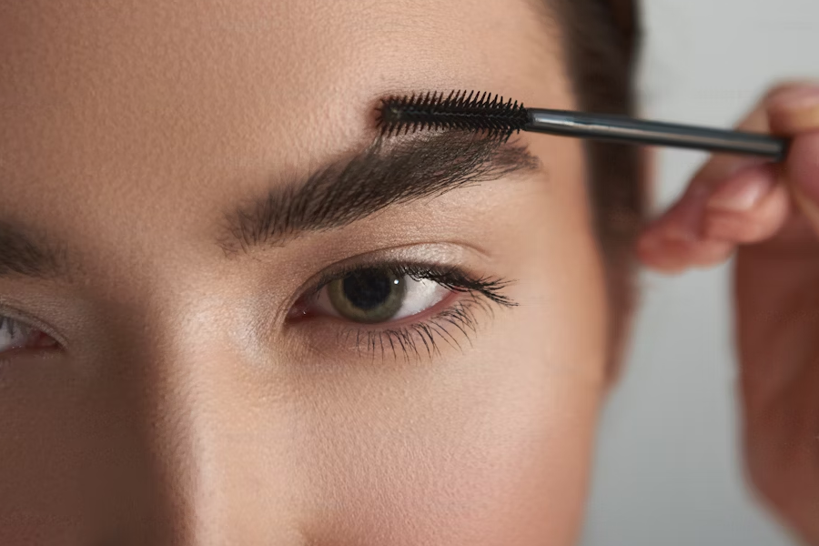 Woman getting their eyebrows done. After brow lift