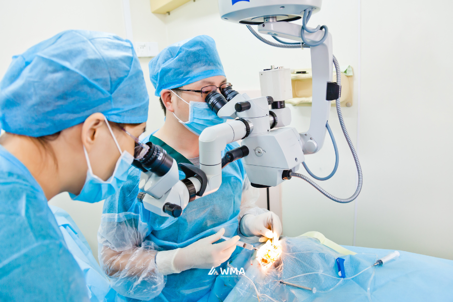 Doctors performing cataract surgery on a patient