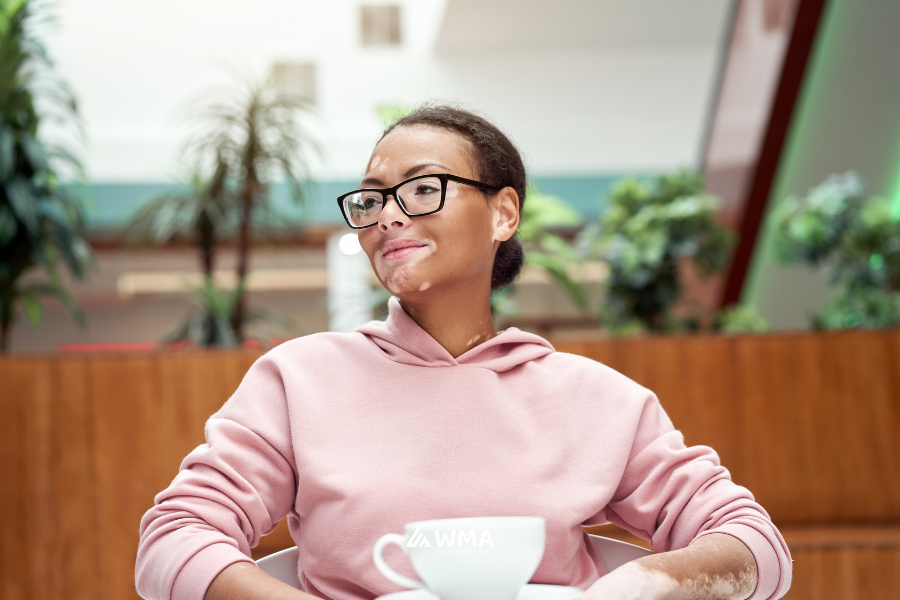 A woman with vitiligo (Autoimmune disease) drinking coffee. 